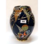 A large Carlton Ware Devils Copse pattern vase on dark blue ground, 29cm high Condition Report: