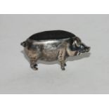 A novelty silver pin cushion modelled as a pig, Birmingham 1905, 4.5cm long Condition Report: