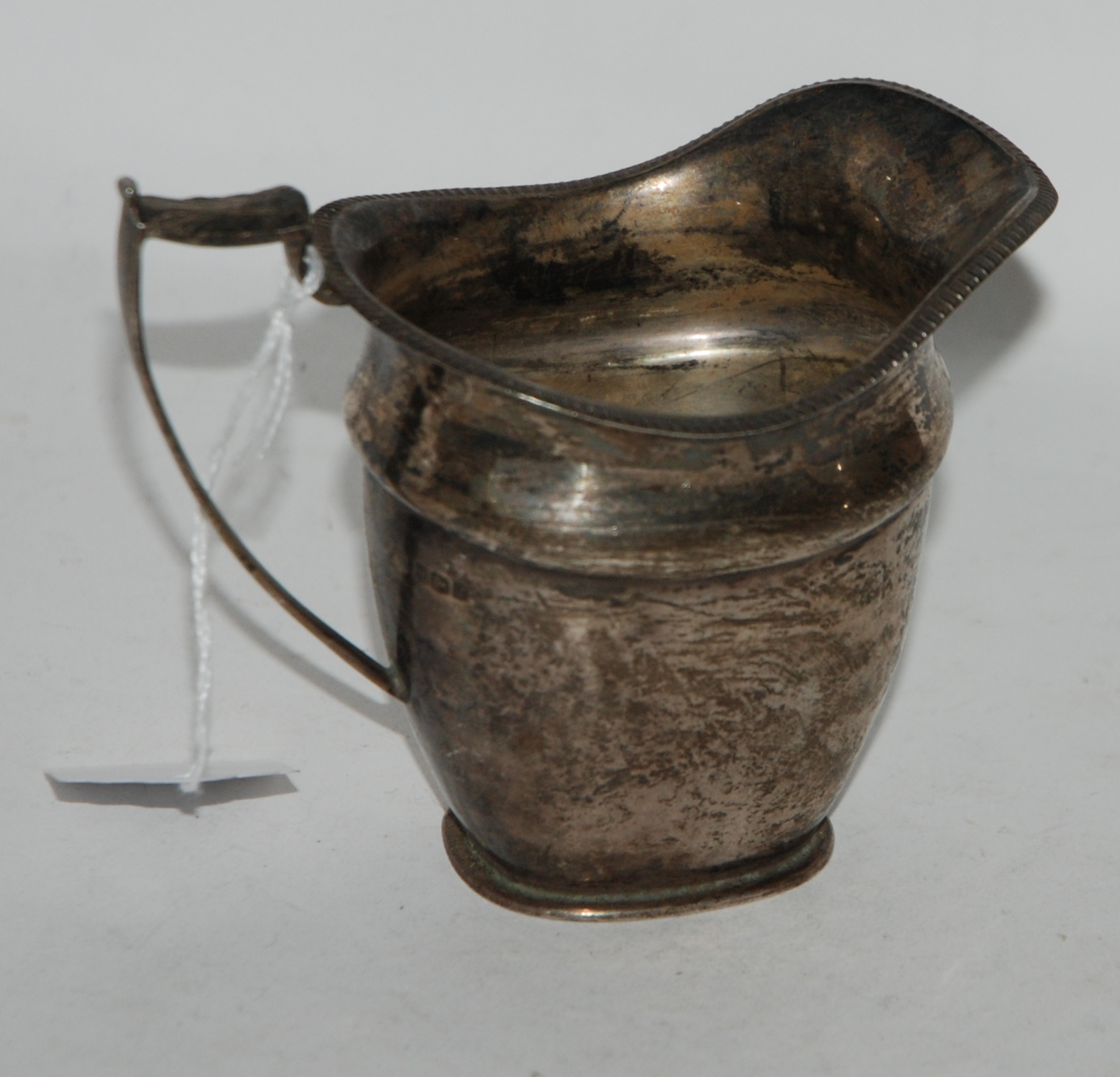 A silver cream jug, Sheffield 1923, 9cm high, 161gms Condition Report: Available upon request