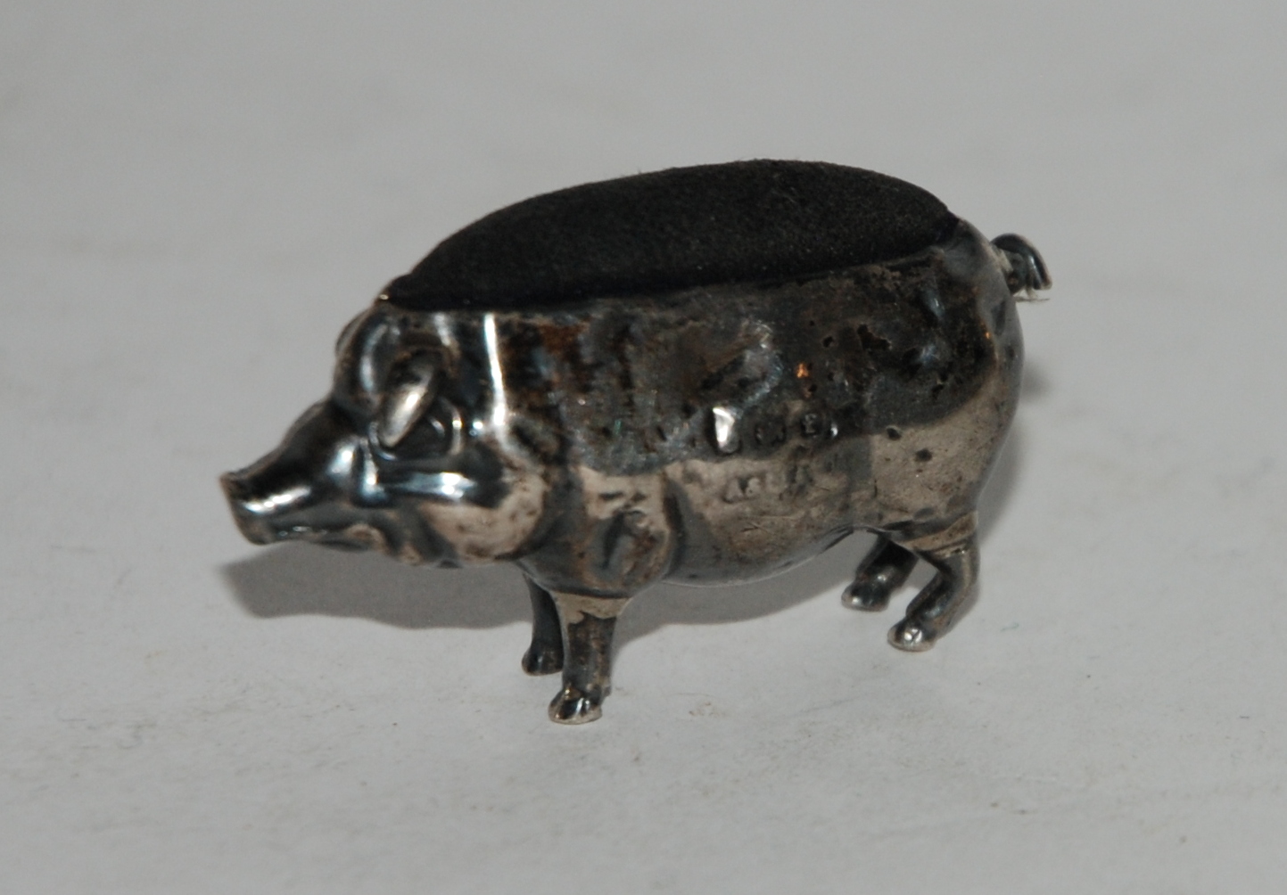 A novelty silver pin cushion modelled as a pig, Birmingham 1905, 4.5cm long Condition Report: - Image 2 of 2