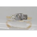An 18ct gold vintage three stone diamond ring set with estimated approx 0.20cts of old cut diamonds,
