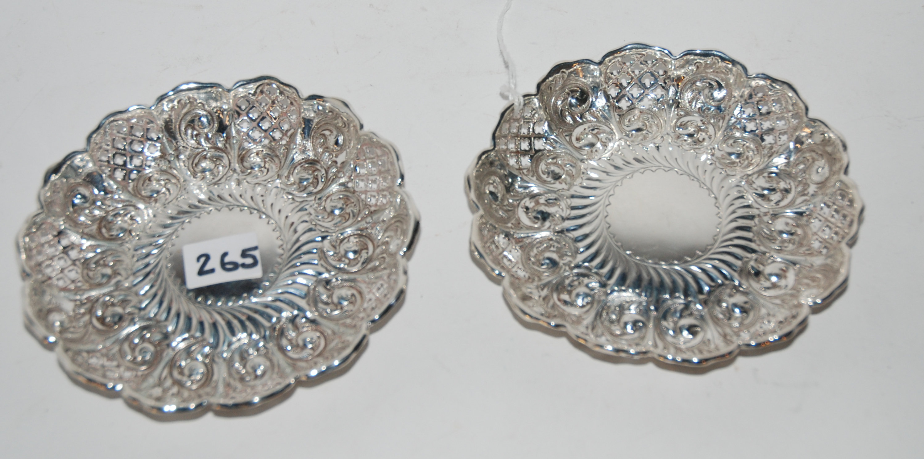 A pair of silver dishes, Sheffield 1895, of circular form with scalloped rim and pierced and foliate - Image 2 of 2