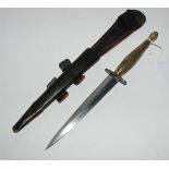 A steel commando dagger in leather scabbard, 34cm overall length Condition Report: