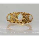 An 18ct gold opal and diamond chip ring, hallmarked Chester 1918, size N, weight 4.3gms Condition