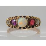 A 9ct gold red, clear and opal set cluster ring, size T1/2, weight 7gms Condition Report: Has been