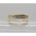 An 18ct gold diamond half eternity ring set with estimated approx 0.50cts of princess cut diamonds