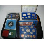 A lot comprising various GB proof coin sets, commemorative crowns, cased silver coins and a Bank