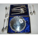 A lot comprising a cased set of grape scissors/nut crackers, a silver card tray, London 1932 and six
