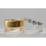 A bright yellow metal three stone diamond ring set with estimated approx 0.50cts, with further