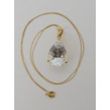 A 9ct gold mounted fantasy cut white topaz pendant and chain, dimensions of pendant with bail 2.