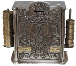 Sovereign change machine GARRETTS BIJOU GOLD CHANGER, An ornate polished metal cabinet with brass