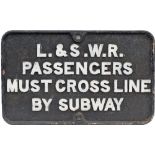 LSWR cast iron sign L&SWR PASSENGERS MUST CROSS LINE BY SUBWAY measuring 25.5in x 16in. In as