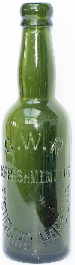 GWR REFRESHMENT DEPARTMENT FISHGUARD HARBOUR green glass Beer Bottle. Stands 9in tall and is in