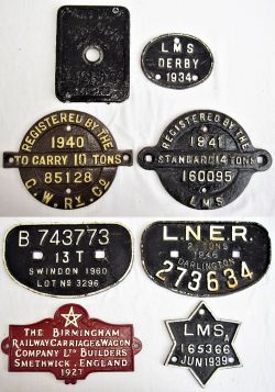 7 x Cast Iron Wagon Plates to include, REGISTERED BY GWR 10 TONS 1940 85128. REGISTERED BY LMS 14