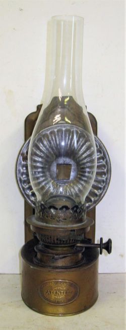 Brass Wall oil lamp made by MESSENGER & SON. Complete with rise and fall burner and reflector. Not