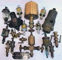 A Lot containing a large collection of steam lubricators, relief valves and anti-vacuum valve in