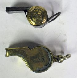 2 x Railway Guards Whistles. N.S.R together with a LNWR small button example.