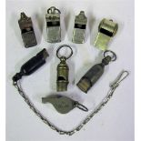 A Lot containing 8 x Whistles. 2 x GWR Bone whistles, one with chain. DR. RAR. WR. UD and 2 x