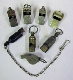 A Lot containing 8 x Whistles. 2 x GWR Bone whistles, one with chain. DR. RAR. WR. UD and 2 x