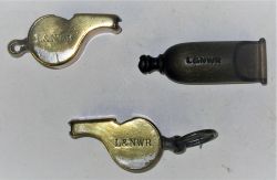 3 x L&NWR Guards Whistles. 2 x Acme Thunderer's stamped L&NWR together with 1 x bone whistle stamped