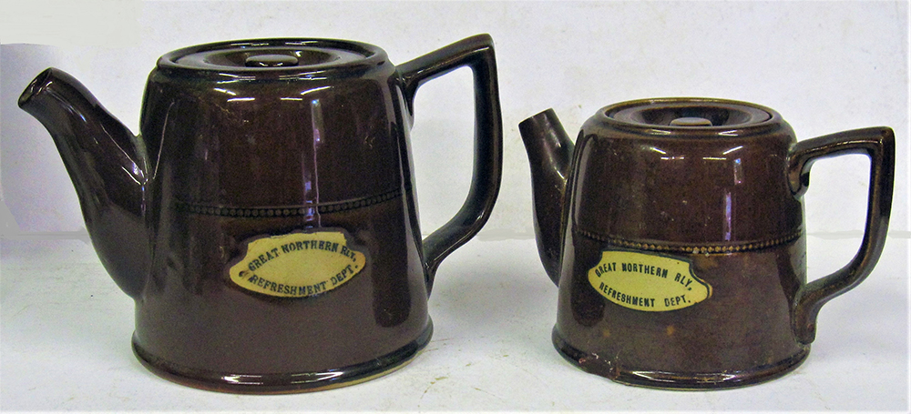 Brown ware GNR Tea pot with minor chip to base together with matching Hot water pot both glazed,