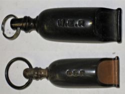 GER Guards bone whistle marked G.E.R complete with chain ring together with NER bone whistle also