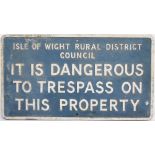 Motoring sign ISLE OF WIGHT RURAL DISTRICT COUNCIL IT IS DANGEROUS TO TRESPASS ON THIS PROPERTY.