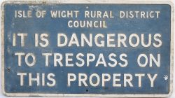 Motoring sign ISLE OF WIGHT RURAL DISTRICT COUNCIL IT IS DANGEROUS TO TRESPASS ON THIS PROPERTY.