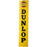 Advertising enamel sign DUNLOP STOCK with DUNLOP in large vertical text. In very good condition with