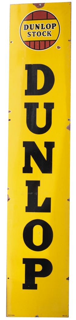 Advertising enamel sign DUNLOP STOCK with DUNLOP in large vertical text. In very good condition with