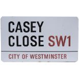 Road enamel sign CASEY CLOSE SW1 CITY OF WESTMINSTER. Fully flanged, measures 30in x 17.5in. In very