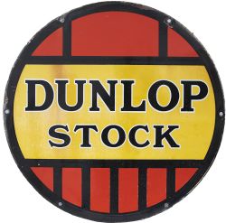 Advertising enamel sign DUNLOP STOCK. In very good condition with minor edge chipping. Measures 24in