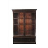 A large stained oak glazed bookcase