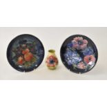 Two Moorcroft plates and a vase