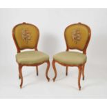 A set of eight French upholstered walnut framed chairs