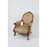 A Victorian upholstered mahogany framed armchair