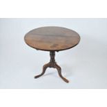 A 19th century oak snap-top occasional tripod table