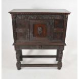 An 18th century and later oak chest on stand