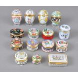 A collection of 15 Halcyon Days enamelled boxes, including four eggs, 6cm, 8 Xmas boxes and 3 (