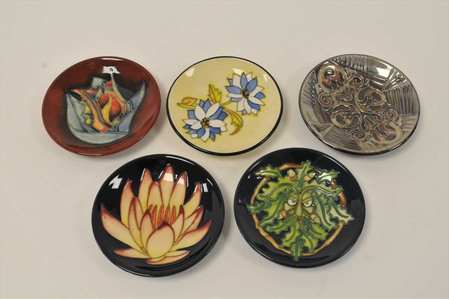 Five Moorcroft coasters/pin dishes