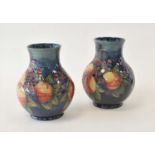 A pair of Moorcroft 'Finches Pecking Fruit' vases
