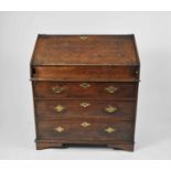 A George III country oak bureau