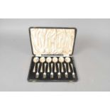 A cased set of twelve silver spoons and forks