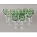 A set of eleven Bohemian green-tinted hock glasses
