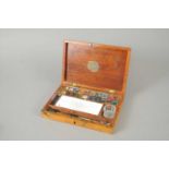 An early 20th mahogany cased century watercolour set