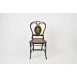 A Victorian black lacquered bedroom chair