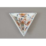 A small Chinese porcelain dish of triangular form in the Imari palette