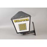 A weathered 20th century outdoor porch / beer garden lamp advertising Wilsons Brewery