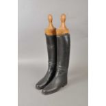 A pair of 20th century black leather riding boots