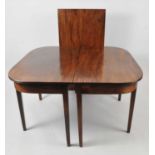 A 19th century mahogany demi-lune dining table